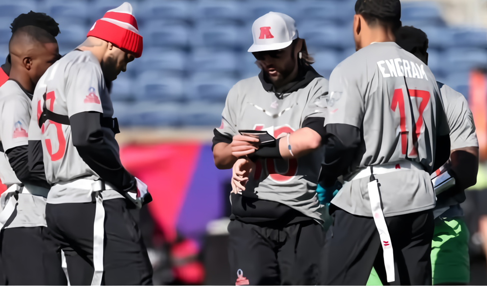 AFC quarterback Gardner Minshew gathers with teammates for a Pro Bowl Flag Football practice, forming a huddle.